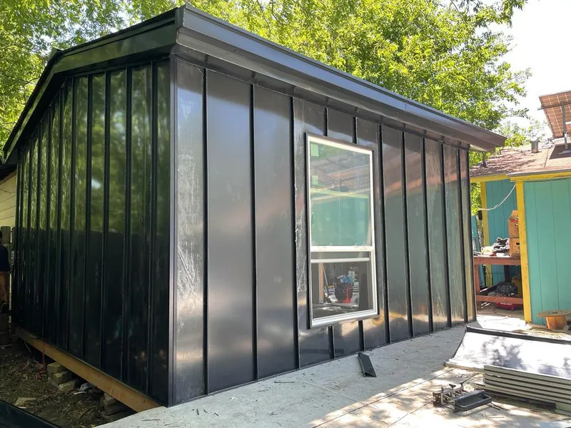 Black standing seam metal wall panels for Roof Inspection in Spencer