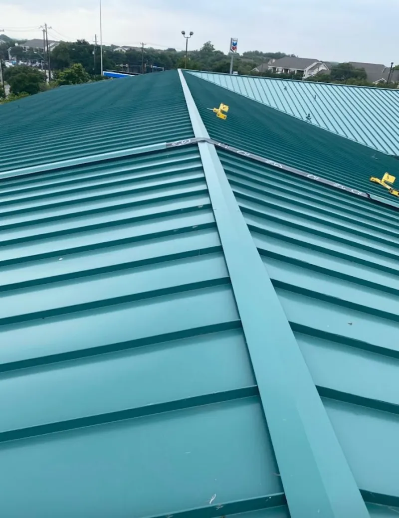 Green commercial metal roof ridge and valley for Metal Roof Repair in Spencer